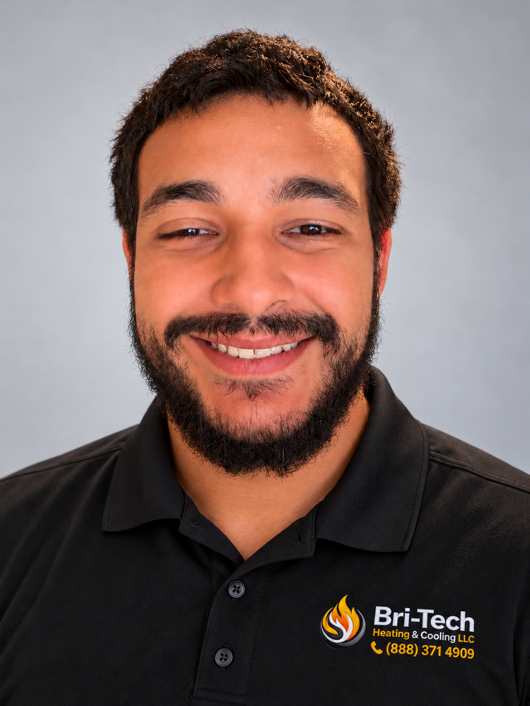 Headshot of Nicky Stanishia Jr. wearing a black Bri-Tech polo
